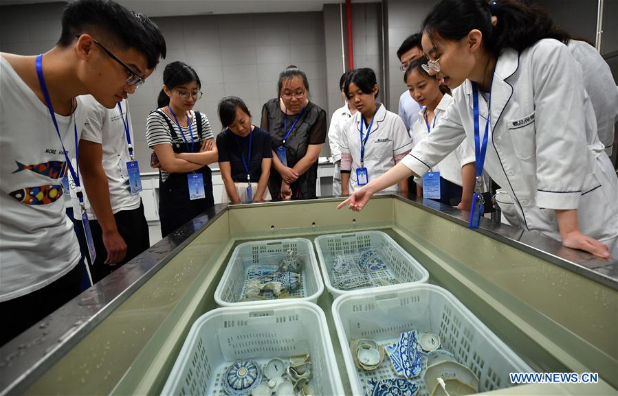 CHINA-HAINAN-ANCIENT CERAMICS-RESTORATION