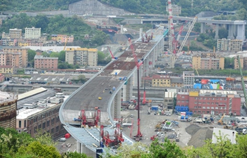 Final span of new Genoa bridge raised in presence of Italian PM