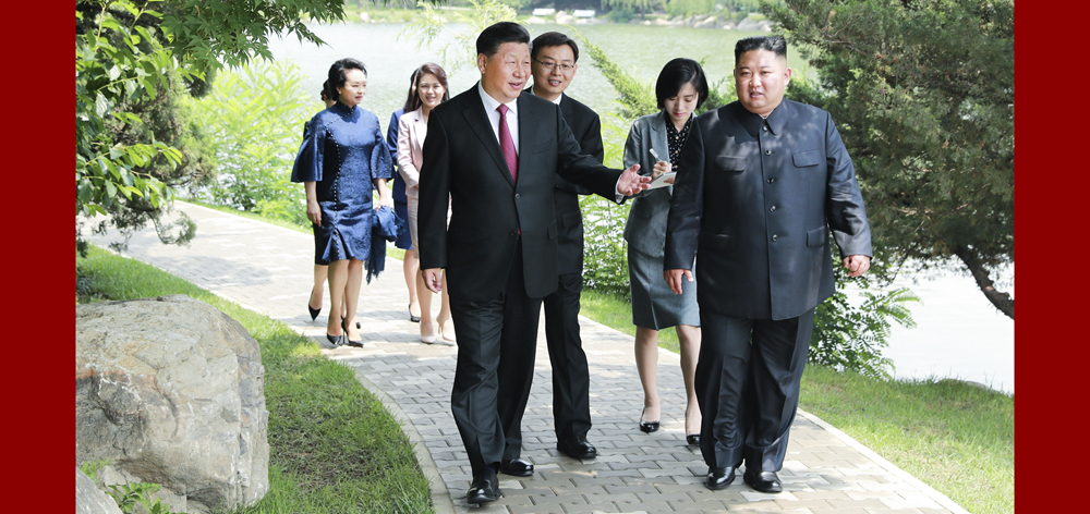 习近平会见朝鲜劳动党委员长、国务委员会委员长金正恩